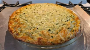 Freshly baked Bisquick quiche with a golden, self-forming crust and a creamy filling of cheese and vegetables