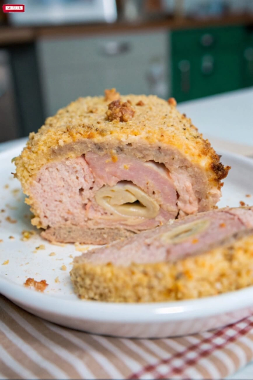  Baked chicken cordon bleu meatloaf with a golden breadcrumb topping and visible filling