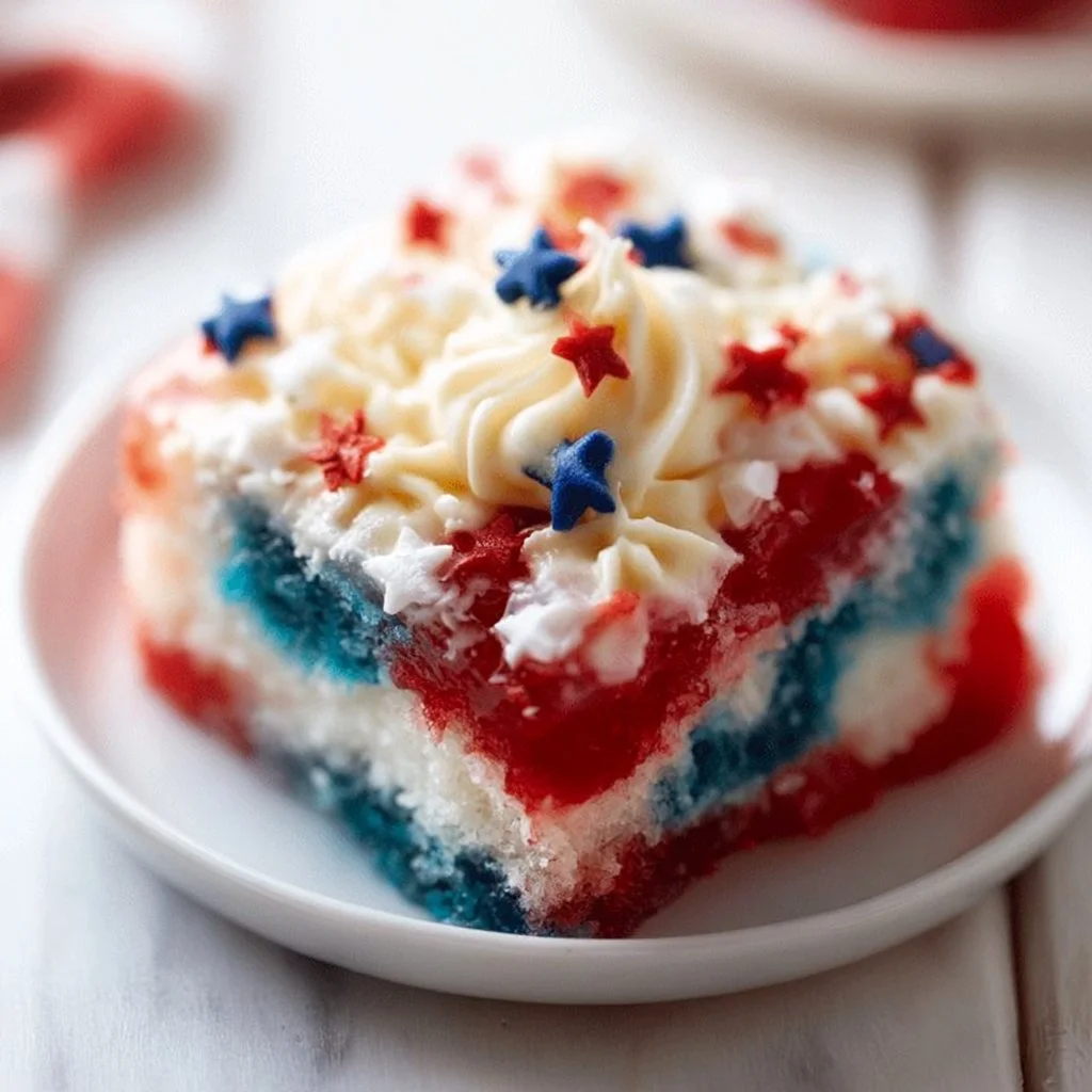 Delicious homemade Poke Cake served on a plate with fresh fruit toppings