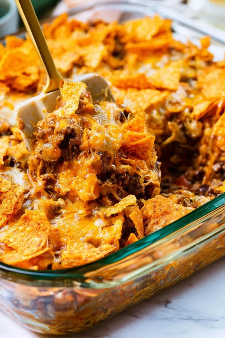 Delicious Beef Doritos Casserole topped with cheese and Doritos, ready to serve.
