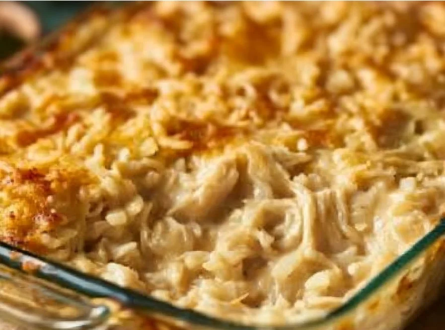 Delicious chicken rice casserole served in a bowl with herbs garnish