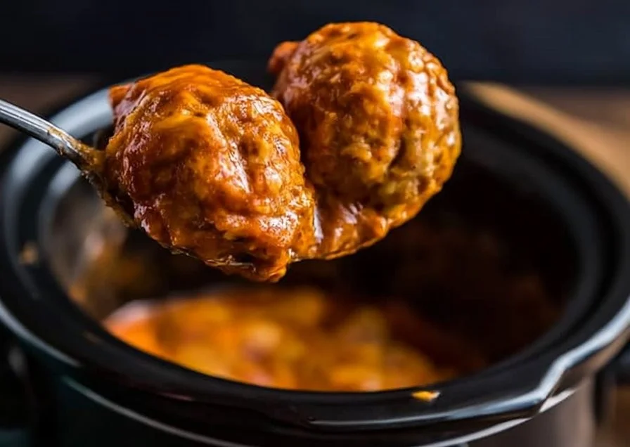 Delicious enchilada meatballs served with sauce and toppings