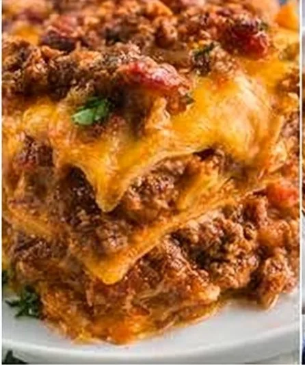Delicious taco casserole served in a baking dish with toppings