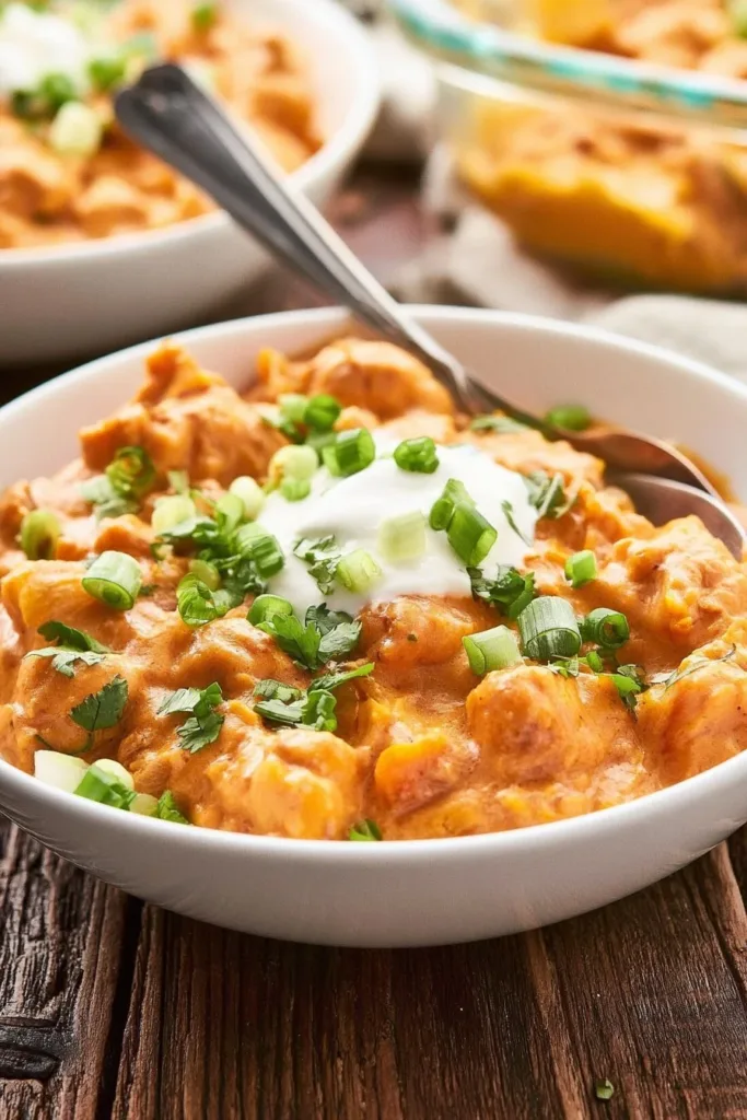 Delicious cheesy chicken rice casserole topped with melted cheese and herbs